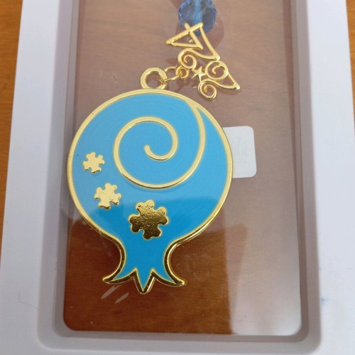 Decorative hanging like new with blue tassel and metal pomegranate