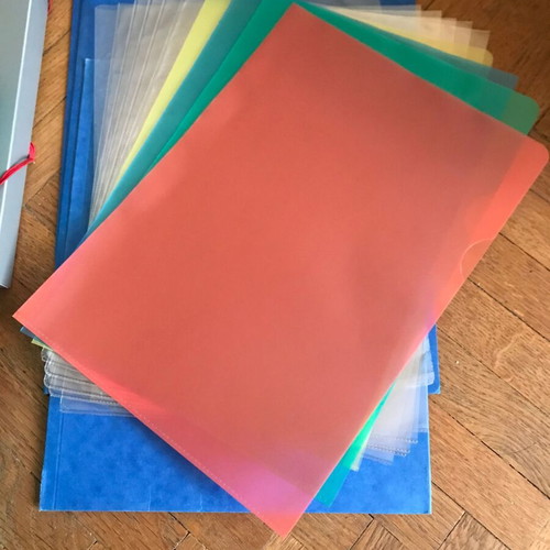 Plastic bag, thick plastic folders, cardboard folders and slides like new