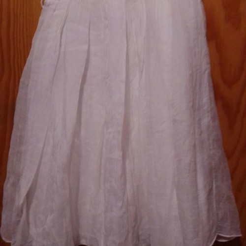 Two white dresses used, sizes 12-14 for girls