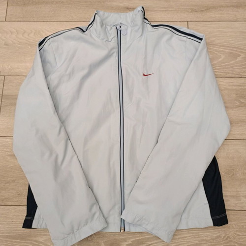 Vintage Nike windbreaker jacket used in ice blue with dark navy details