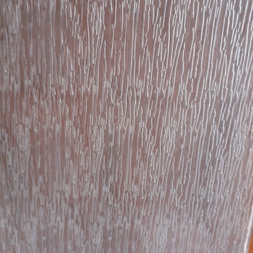 Large diamond-patterned glass used with water design for interior door