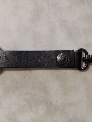 Men's leather keychain used with engraved phrase I will be back