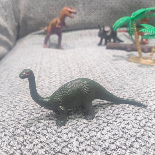 Dinosaur figure set like new, 9 figures with trees and sticks
