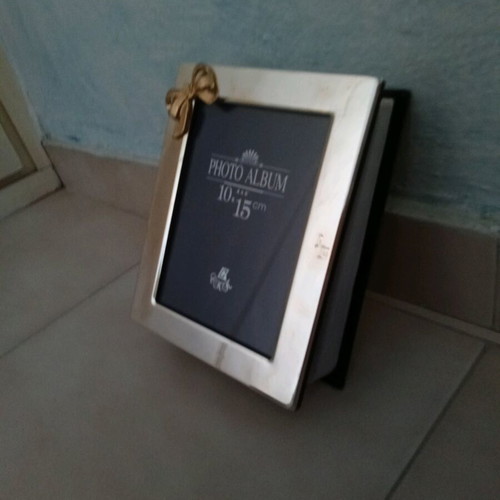 Silver plated photo album frame 10x15 like new with gold bow