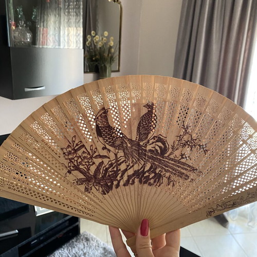 Vintage wooden hand fan used with bird designs