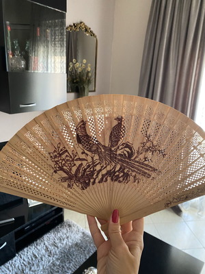 Vintage wooden hand fan used with bird designs