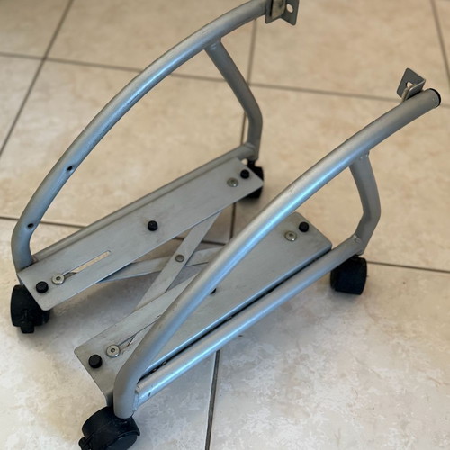 Metal computer tower stand used with wheels