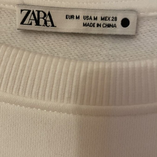 Zara blouse with silver and black rhinestones, fleece interior, like new, size M