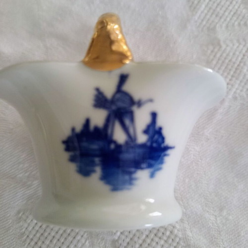 Porcelain decorative basket vintage with blue windmill and gold handle like new