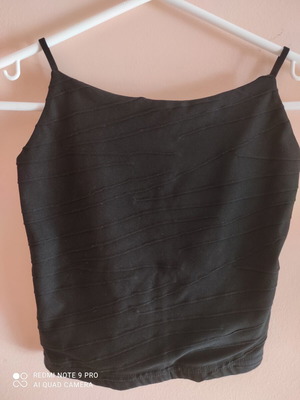 Black top with embossed front, like new, sizes XS and S