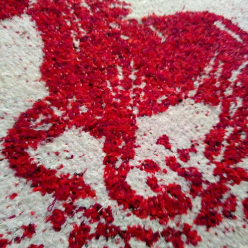 Red rug with white horse design like new, handmade