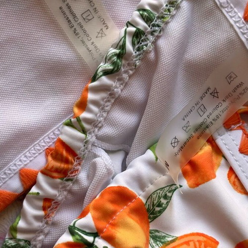 Women's swimsuit like new, white and orange with orange print, size M