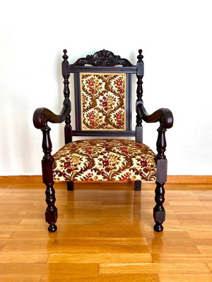 Armchair used with floral pattern and carved wooden frame