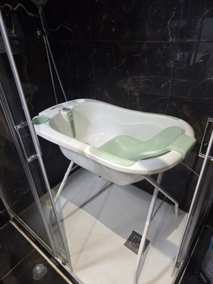 Baby bath with seat, thermometer and stand