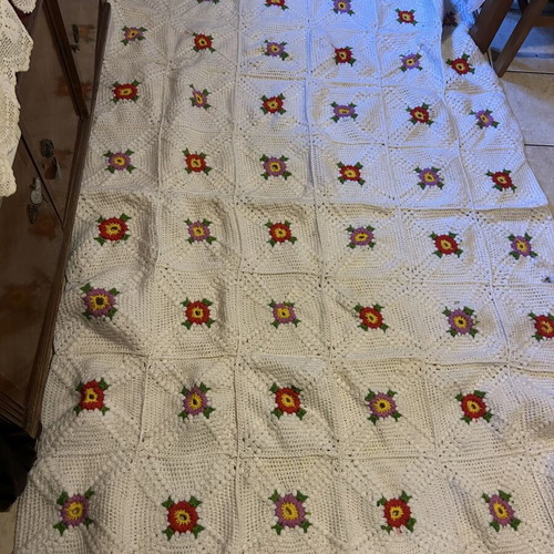 Handmade blanket used with floral crochet design