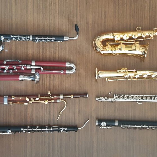 Set of miniature wooden and metal wind instruments like new