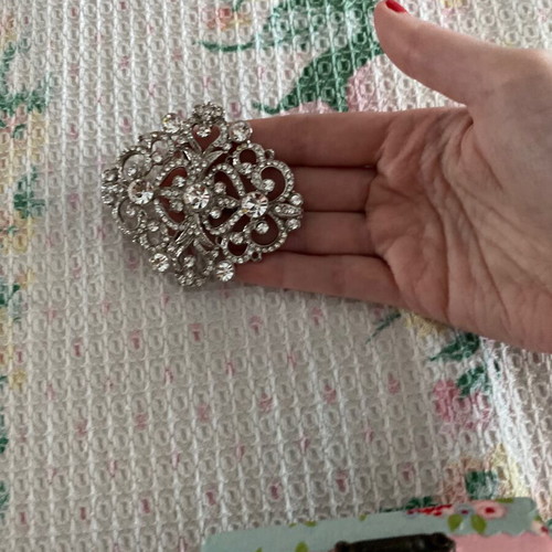 Silver brooch with stones