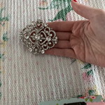 Silver brooch with stones