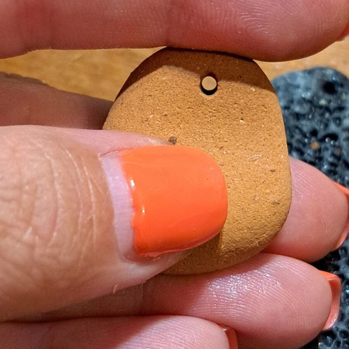 Natural raw stones like new, oval terracotta and textured gray