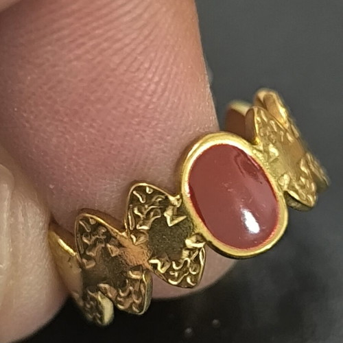 Adjustable women's gold ring with red stone and butterfly design
