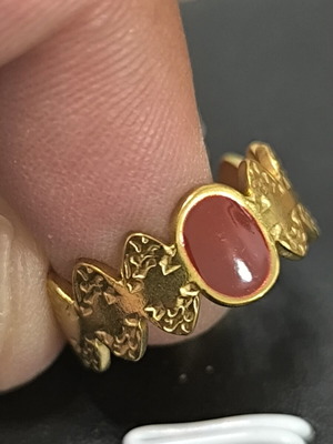 Adjustable women's gold ring with red stone and butterfly design