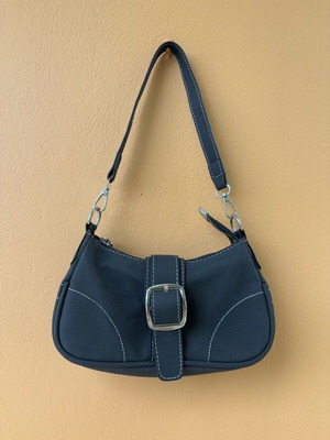 Black suede shoulder bag like new with white stitching and zipper closure