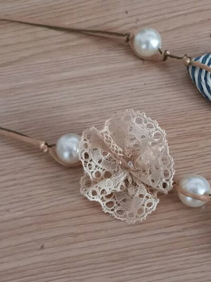 Women's necklace used handmade with pearls and cord