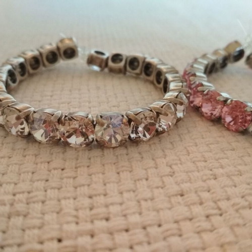Set of three tennis bracelets like new, pink and white