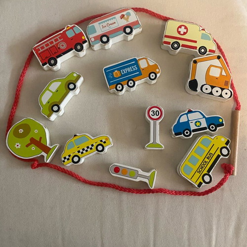 Fine motor skills toy used with cars on a string