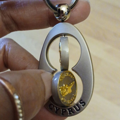 Collectible metal keychain Cyprus spinning, like new, gold and silver