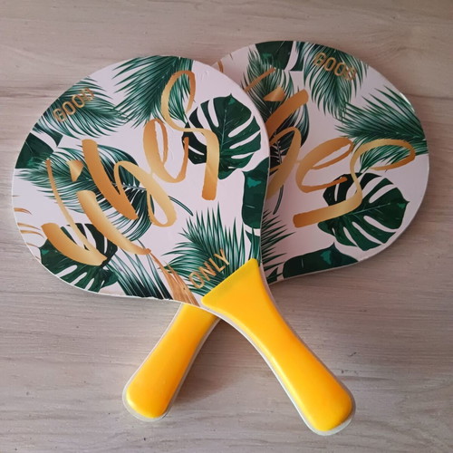 Pair of wooden children's rackets used with signs of wear