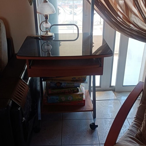 Compact computer desk with glass surface and wheels like new