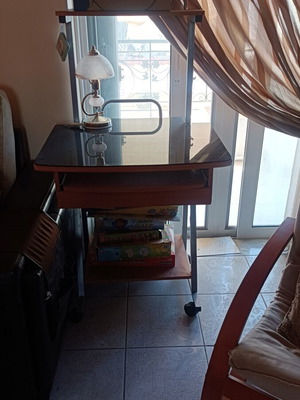 Compact computer desk with glass surface and wheels like new