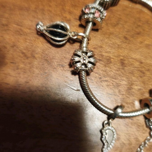 Pandora bracelet authentic used size 16 with 6 charms and safety chain