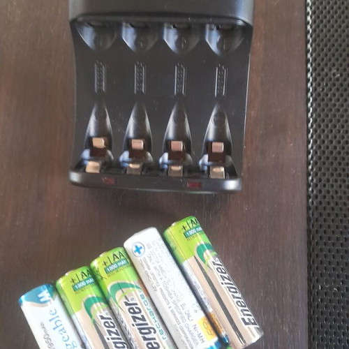 Rechargeable AA batteries with 4-slot charger like new