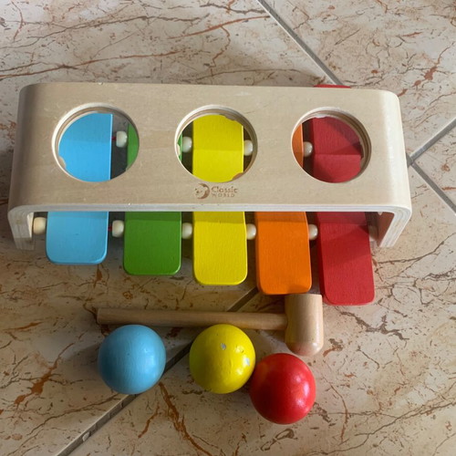 Baby toy like new, one ball with color damage