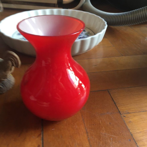 Glass vase used, red with white interior, two-tone