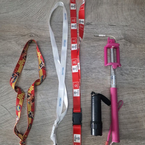 Flashlight, selfie stick and three keychain lemus used