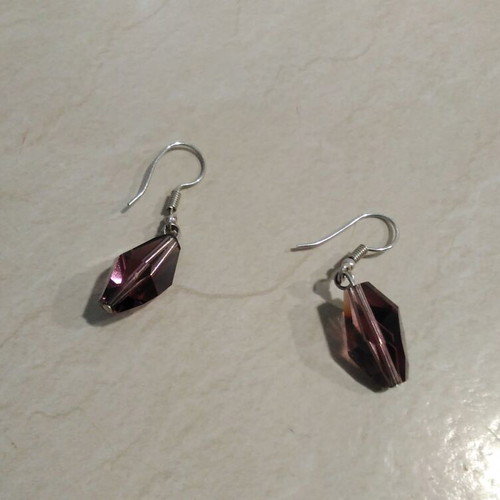 Earrings pair with sparkling purple diamonds like new