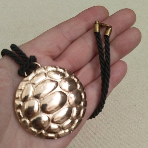 Pendant like new with turtle design on black cord