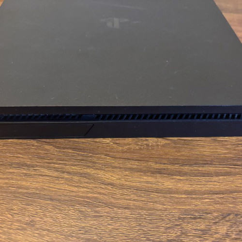 Sony PlayStation 4 Slim 500GB console with controllers