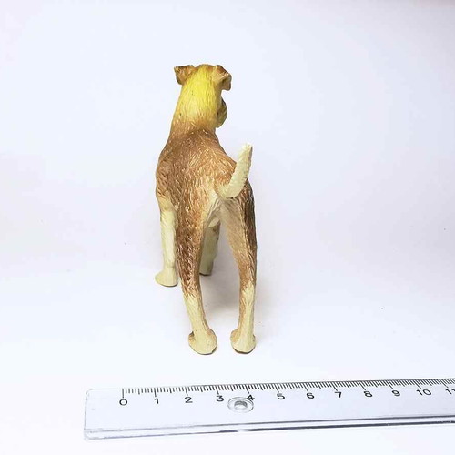 Dog plastic figure used with scratches and marks
