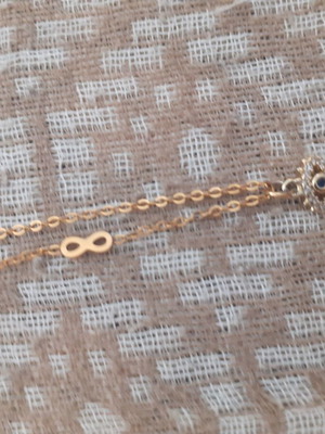 Short necklace with eye and infinity symbol new, gold color