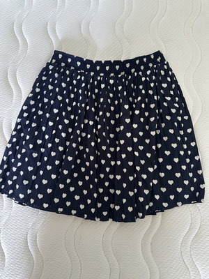 Stradivarius mini skirt with hearts, size S
