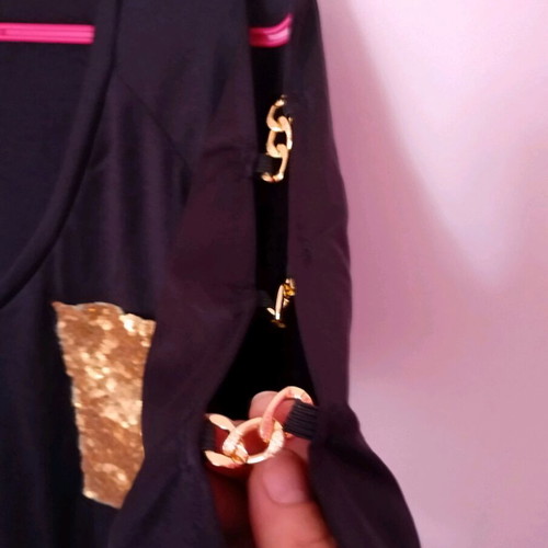 Black elastic blouse with sequin pocket and cutout, like new