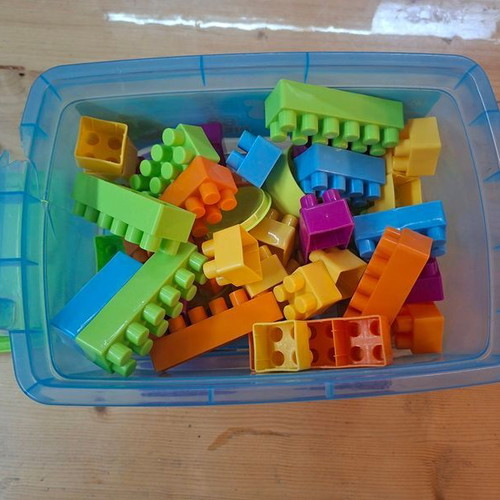 Educational building blocks set with 62 colorful pieces in wheeled box