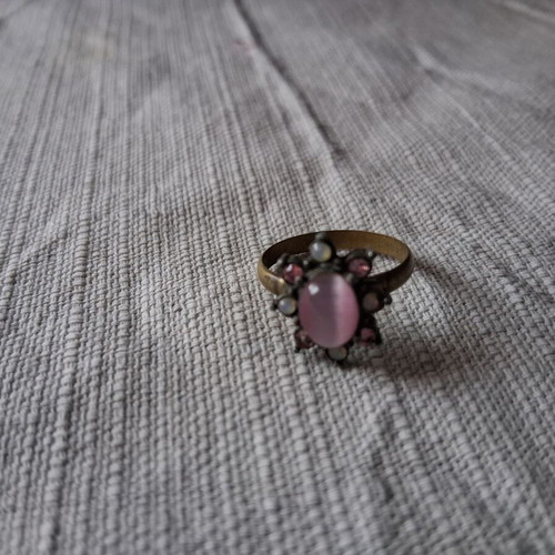 Ring used matte gold color with pink stone and rhinestones