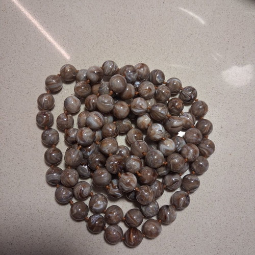 Vintage necklace like new, long with earth tone round beads