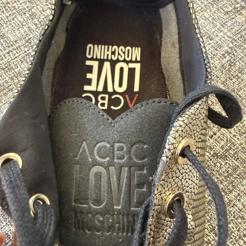 Love Moschino women's sneakers size 39 like new, black and gold