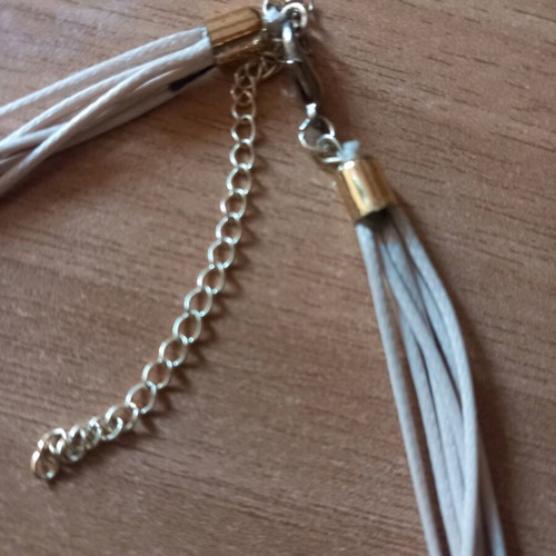 Star Necklace with Beige Cord and Multiple Layers Like New